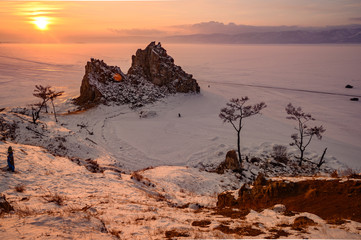 Sunset view of Shaman rock one of sacred place in frozen lake Baikal in winter season of Siberia,...