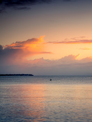 Naklejka premium Boat with Dawn Cloudscape Portrait Mode