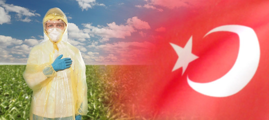 Doctor in PPE suit uniform against coronavirus and national flag. Turkey .The concept of national holidays. 3D illustration