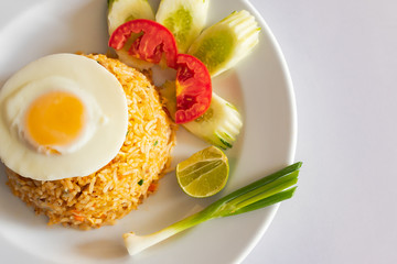 Pork fried rice, add eggs in a white dish