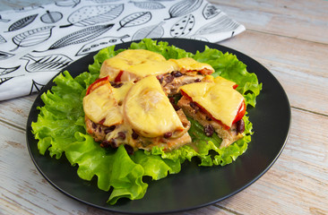 Baked chicken with mushrooms and vegetables and cheese with herbs