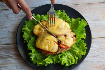 Baked chicken with mushrooms and vegetables and cheese with herbs