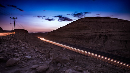 highway long exposure vehicle light trails curvy highway between mountains i sunset 
eilat israel.