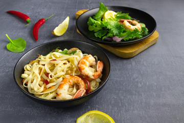 Stir fry noodles with vegetables and shrimps in bowl.