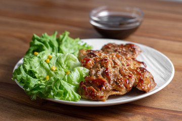 dish of teriyaki chicken with salad, corn and ssame seeds