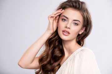 Portrait of a young beautiful woman with a long hair.