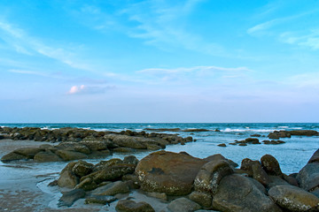 
The beach, the sea has rocks and sand. It is a beautiful atmosphere.