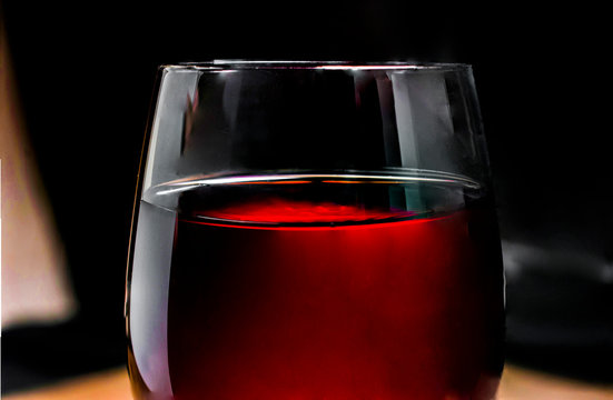 A cup of wine in a dark environment winery concept, close up or macro photography