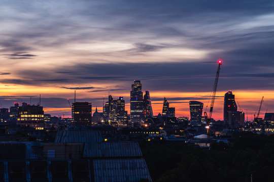 London capital, night sky aerial view city center, dramatic sunrise skyline