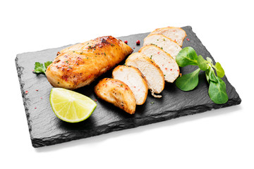 Grilled chicken breast. Sliced chicken fillet with lime isolated on white background	