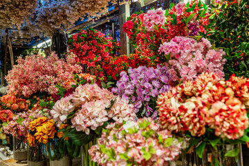 Large selection of beautiful fresh flowers in the store. Background. Postcard.