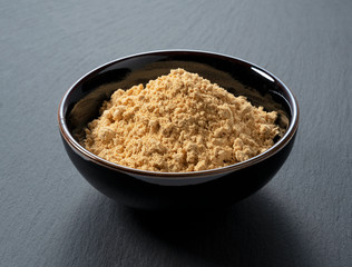 Japanese soybean flour on a black background