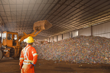 workers in recycling factory,engineers standing in recycling center.Garbage recycle in the factory...