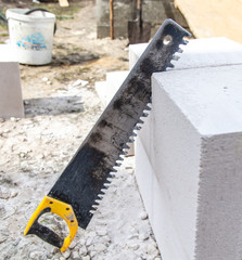 Saw for sawing bricks from foam concrete.