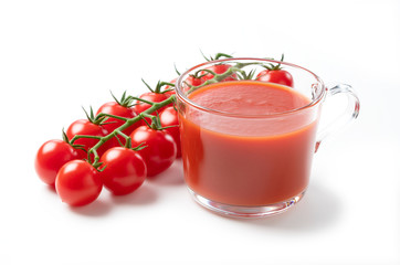 Tomato juice and tomatoes placed on a white background