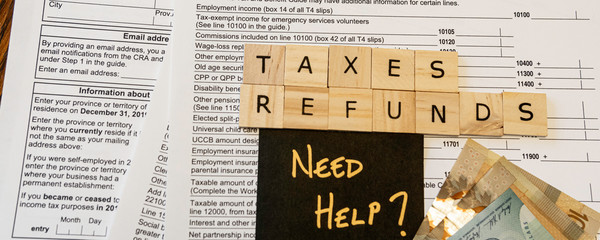 New Canadian personal tax forms and letter tiles showing refunds and taxes - Banner panorama