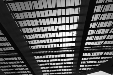 The architecture of roof showing line structure  black & white theme at dawn.
