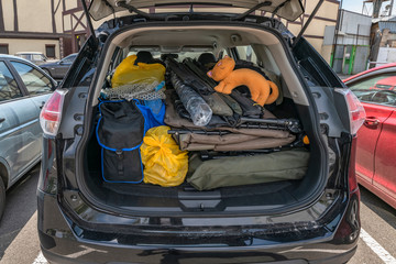 Overloaded trunk of fisherman car before go fishing