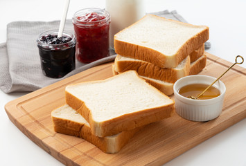 Breakfast image with jam, bread and honey