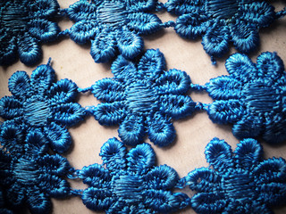 Beautiful wallpaper of knitted fabric blue floral texture