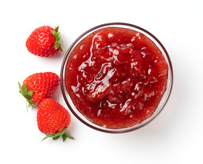 Strawberry jam and strawberry fruit placed on a white background