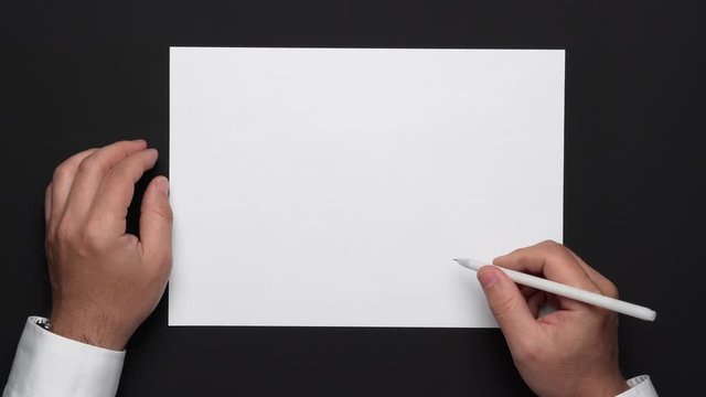 a blank sheet of paper and a businessman's hands on a black table, a white shirt and a wrist watch, a top view-a template for any text or inscription