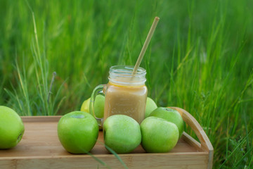 delicious smoothie and green apples