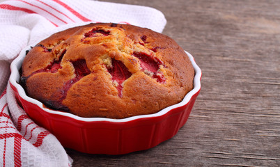 Fresh, homemade cake with strawberris,  wooden background