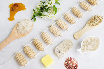 Concept of Spa-cosmetic and cosmetic procedures. Spa-sea salt, wooden comb, massager, handmade...