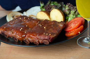 Pork rib grill with barbecue sauce on the plate