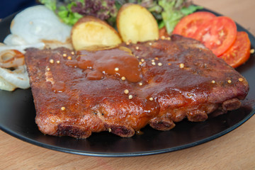 Pork rib grill with barbecue sauce on the plate