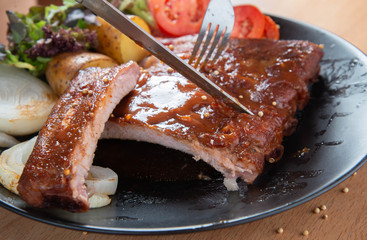 Pork rib grill with barbecue sauce on the plate