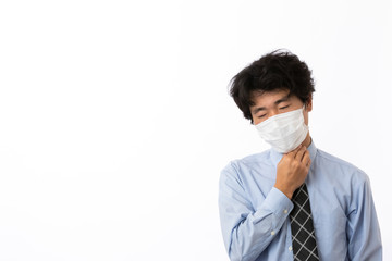 風邪の症状があるビジネスマン　喉が痛い