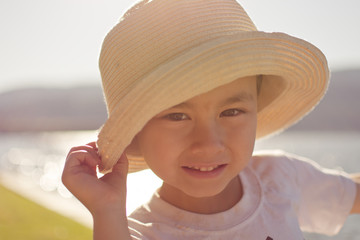 Portrait Of A Boy With A Sunhat On