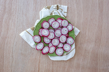 Slicing Fresh Red Horseradish from above sliced