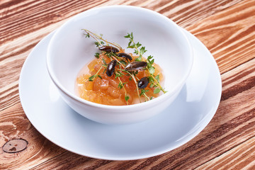 Asian cuisine Australian cockroaches on caramel apple on wood background