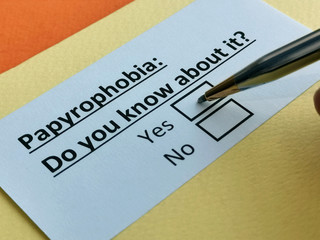 Fototapeta premium One person is answering question about papyrophobia.