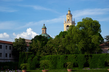 Scenic wiev ot italian historical gardens with baroque bells tower.