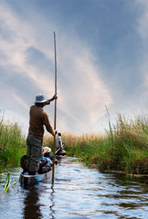 Boat trip in a traditional Makoro at the Okavango Delta, Botswana