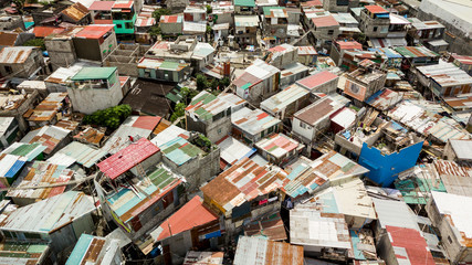 A typical squatter area in the Philippines. Houses made of hollow blocks and corrugated sheet metal.