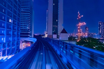 Fototapeta premium Japan. Railway tracks in Tokyo. Urban landscape in blue. Transport system of Japan. Railway in the business center of Tokyo. Evening in the Japanese capital. Travel to East Asia.