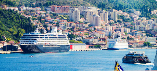 Cruiseship or cruise ship liner in port of Dubrovnik, Croatia during summer with scenic and...