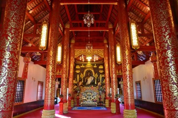 Fototapeta na wymiar Marvellous prayer hall and shrine at Wat Phra Kaew in Chiang Rai
