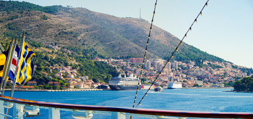 Cruiseship or cruise ship liner in port of Dubrovnik, Croatia during summer with scenic and...