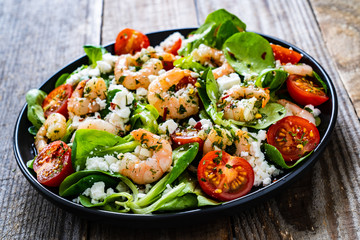 Prawn salad on wooden table
