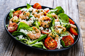 Prawn salad on wooden table
