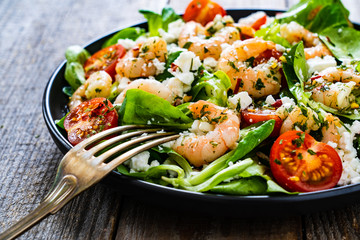 Prawn salad on wooden table
