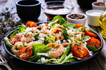 Prawn salad on wooden table
