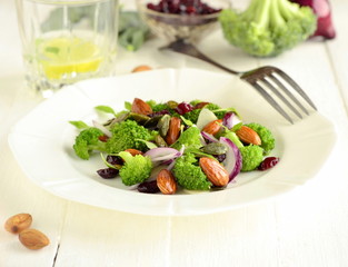Broccoli salad with red onions, almonds and dried cranberries