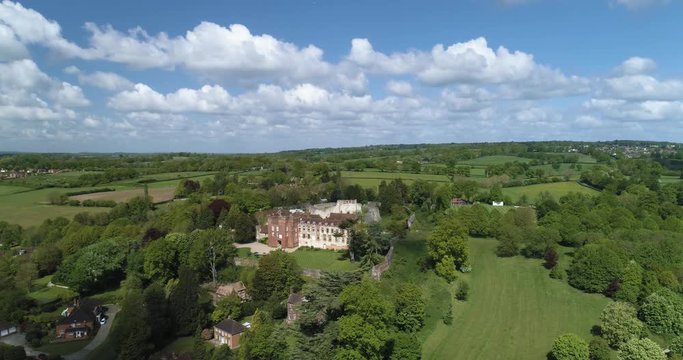 Stunning cinematic shot of English Country Home and Castle in the sunshine